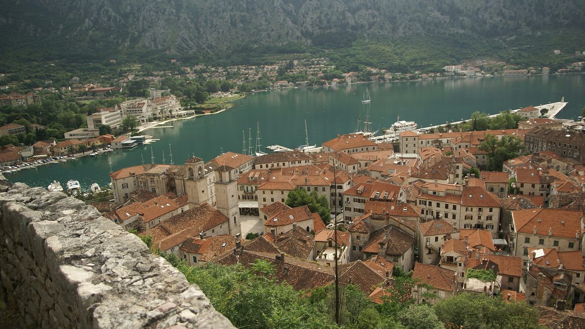 Kotor's old town seen from the fortress wall, with the bay behind